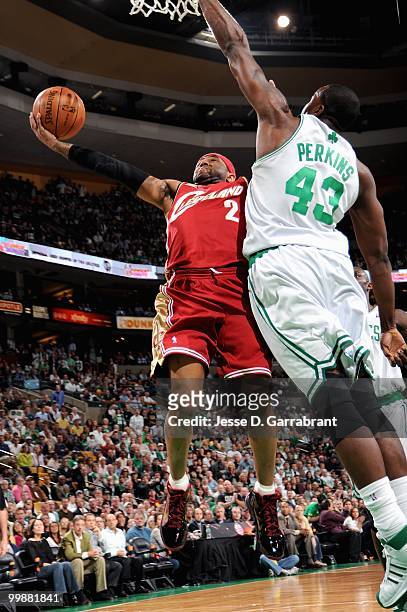Mo Williams of the Cleveland Cavaliers lays the ball up against Kendrick Perkins of the Boston Celtics in Game Six of the Eastern Conference...