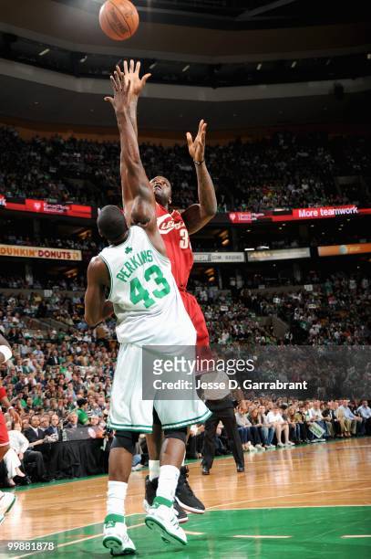 Shaquille O'Neal of the Cleveland Cavaliers shoots over Kendrick Perkins of the Boston Celtics in Game Six of the Eastern Conference Semifinals...