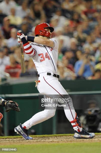 Bryce Harper of the Washington Nationals hits a home run in the eighth inning against the Boston Red Sox at Nationals Park on July 2, 2018 in...