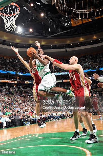 Tony Allen of the Boston Celtics goes to the basket against Delonte West and Zydrunas Ilguaskas of the Cleveland Cavaliers in Game Six of the Eastern...