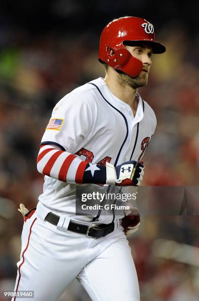 Bryce Harper of the Washington Nationals rounds the bases after hitting a home run in the eighth inning against the Boston Red Sox at Nationals Park...