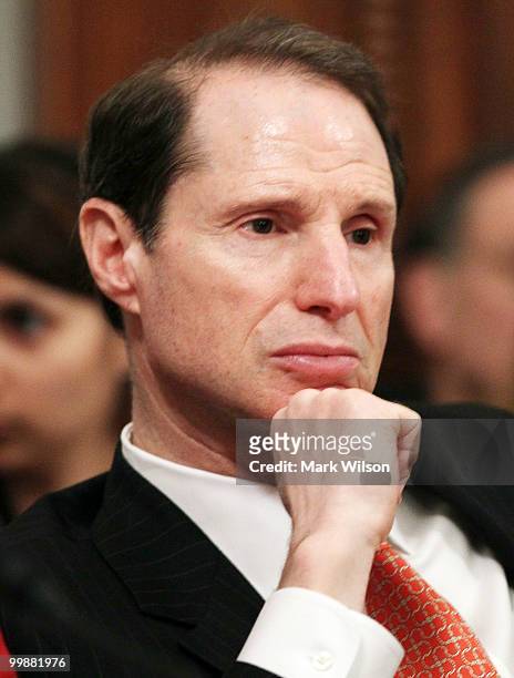 Sen. Ron Wyden , listens to Interior Secretary Ken Salazar testify during a Senate Energy and Natural Resources Committee hearing on Capitol Hill on...
