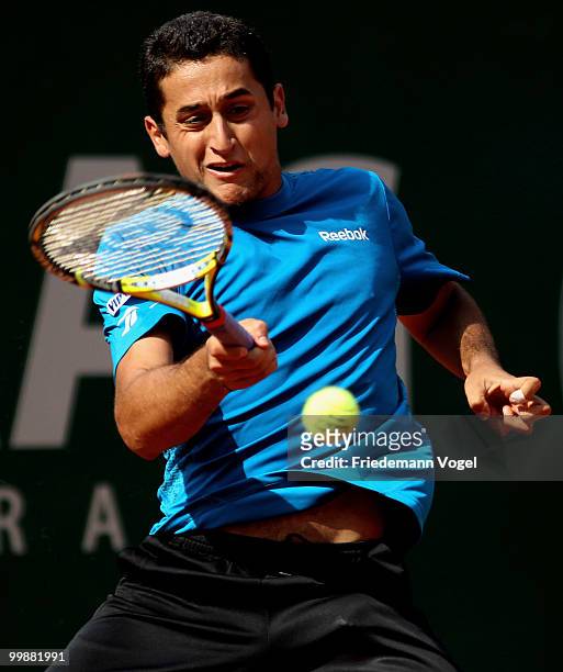 Nicolas Almagro of Spain plays a backhand during his match against Robby Ginepri of USA during day three of the ARAG World Team Cup at the Rochusclub...