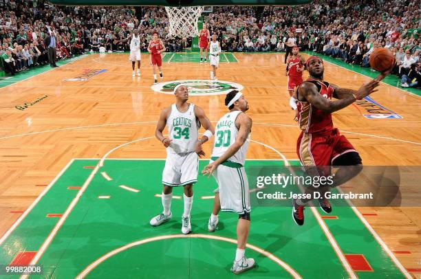 LeBron James of the Cleveland Cavaliers puts a shot up over Paul Pierce and Rasheed Wallace of the Boston Celtics in Game Six of the Eastern...