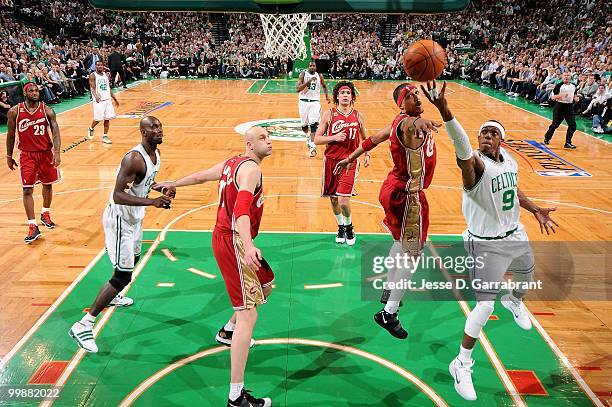 Rajon Rondo of the Boston Celtics goes to the basket against Jamario Moon and Zydrunas Ilgauskas of the Cleveland Cavaliers in Game Six of the...