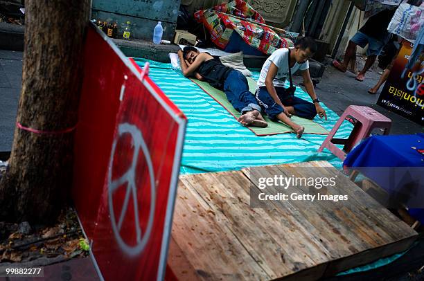 Thai anti-government red shirt protesters rest near their main rally site on May 18, 2010 in Bangkok, Thailand. Protesters have clashed with military...