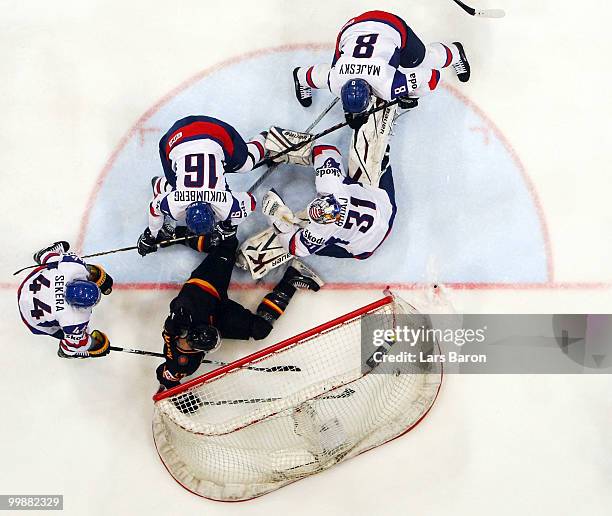 Christoph Ullmann of Germany scores a irregular goal with his foot past goaltender Peter Budaj of Slovakia during the IIHF World Championship...