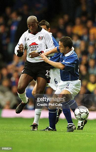 Dennis Wise of Leicester tries to tackle Luis Boa Morte of Fulham during the FA Barclaycard Premiership match between Leicester and Fulham at Filbert...
