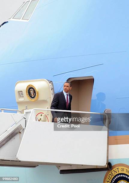 President Barack Obama boards Air Force One at Joint Base Andrews Naval Air Facility May 18, 2010 in Camp Springs, Maryland. Obama is on a trip to...