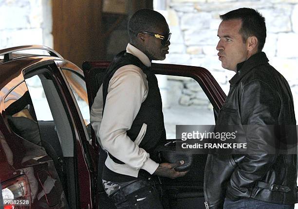 French forward Djibril Cisse arrives at France's national football team pre-World Cup training camp for the upcoming FIFA 2010 World Cup in Tignes,...