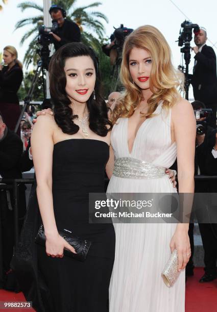 Model Doutzen Kroes and actress Fan Bing Bing attends the "Of Gods And Men" Premiere at the Palais des Festivals during the 63rd Annual Cannes Film...