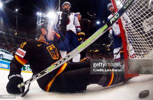 Christoph Ullmann of Germany celebrates after scoring a irregular goal with his foot past goaltender Peter Budaj of Slovakia during the IIHF World...