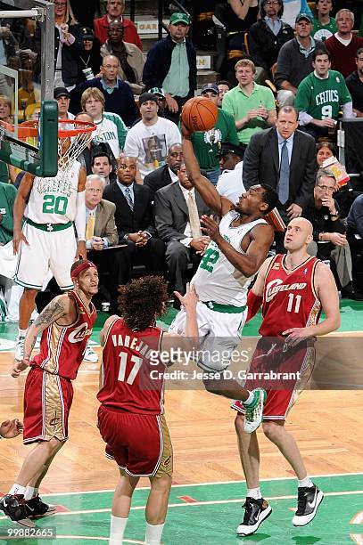 Tony Allen of the Boston Celtics lays the ball up over Delonte West, Anderson Varejao and Zydrunas Ilgauskas of the Cleveland Cavaliers in Game Six...