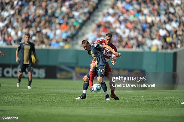 Kyle Nakazawa of the Philadelphia Union and Daniel Hernandez of FC Dallas fight for the ball on May 15, 2010 at Lincoln Financial Field in...