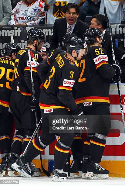 Head coach Uwe Krupp of Germany speaks to his players during the IIHF World Championship qualification round match between Slovakia and Germany at...