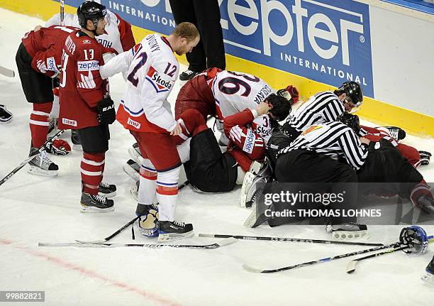 Canada's and Czech's players fight after the IIHF Ice Hockey World Championship match Canada vs Czech Republic in the southern German city of...