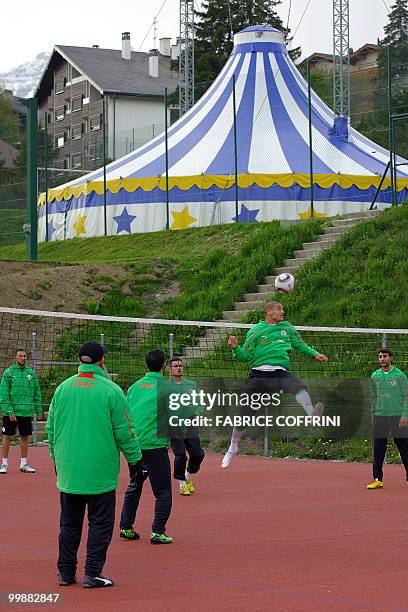 The Algerian national football team play at a volleyball area during a practice on May 18, 2010 in the Swiss Alpine resort of Crans-Montana ahead of...