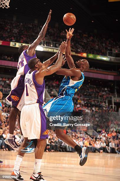 Emeka Okafor of the New Orleans Hornets puts a shot up against Amar'e Stoudemire of the Phoenix Suns during an NBA Game on March 14, 2010 at U.S....