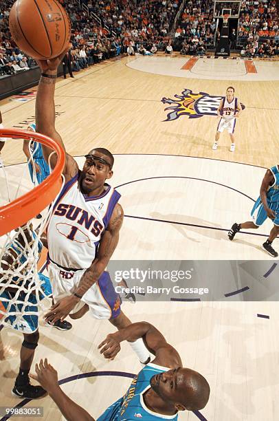 Amar'e Stoudemire of the Phoenix Suns makes a dunk against the New Orleans Hornets in an NBA Game on March 14, 2010 at U.S. Airways Center in...