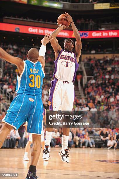 Amar'e Stoudemire of the Phoenix Suns makes a jumpshot against the New Orleans Hornets in an NBA Game on March 14, 2010 at U.S. Airways Center in...