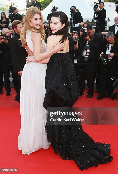 Model Doutzen Kroes and actress of Fan Bing Bing attends the "Of Gods And Men" Premiere at the Palais des Festivals during the 63rd Annual Cannes...