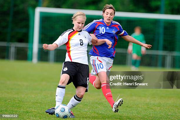 Germany's Elisabeth Scherzberg battles for the ball with France's Claire Lavogez during the U16 women international friendly match between France and...