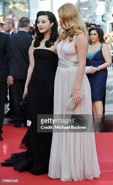 Model Doutzen Kroes and actress of Fan Bing Bing attends the "Of Gods And Men" Premiere at the Palais des Festivals during the 63rd Annual Cannes...