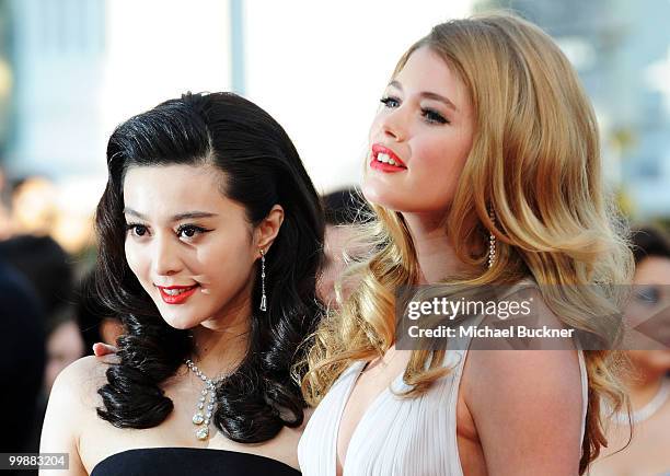 Model Doutzen Kroes and actress of Fan Bing Bing attends the "Of Gods And Men" Premiere at the Palais des Festivals during the 63rd Annual Cannes...