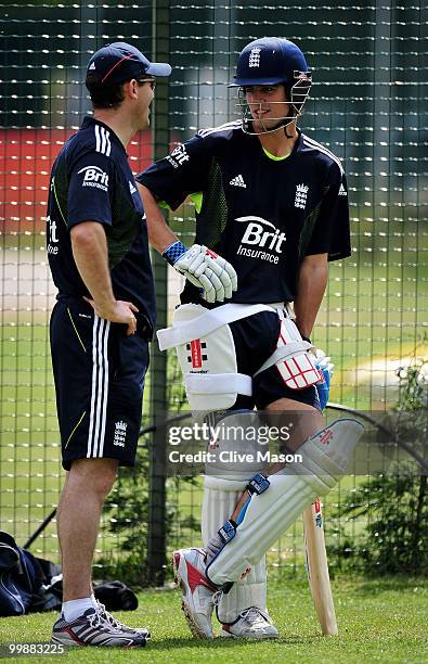 Alastair Cook of England Lions talks with coach Dene Hills during a net session at The County Ground on May 18, 2010 in Derby, England.