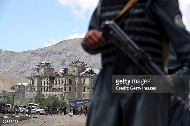 Afghan and foreign investigators inspect the site of a suicide car bomb attack on May 18, 2010 in Kabul, Afghanistan. The Taliban attack targeting a...
