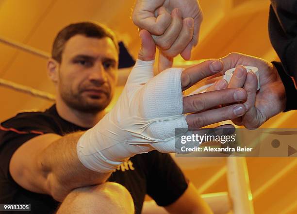 Ukrainian boxer Vitali Klitschko gets his hands wrapped during a training session on May 18, 2010 in Going, Austria. The WBC Heavyweight World...