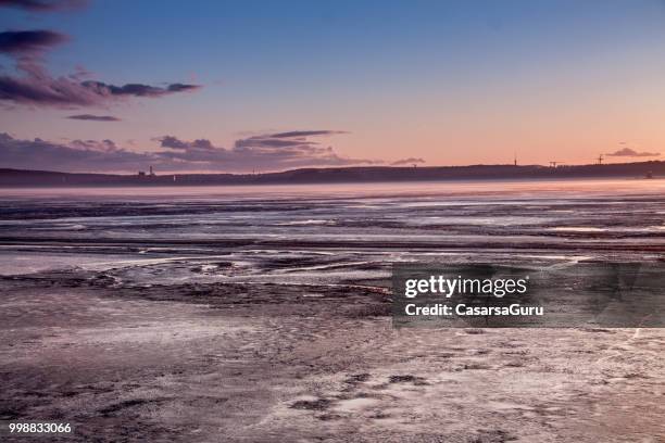 scenic view of frozen lake against pink and blue sky - tampere stock pictures, royalty-free photos & images