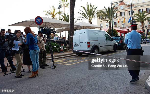 Media gather outside the Hotel Miramar where two children, believed to be British, have been found dead in a hotel room on May 18, 2010 in the Costa...