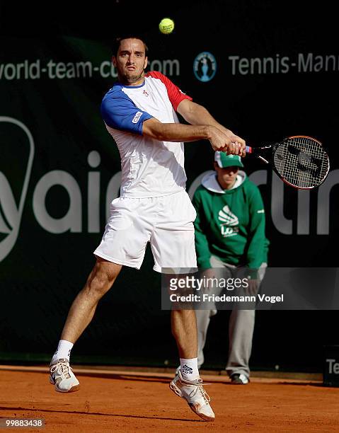Viktor Troicki of Serbia plays a backhand during his match against Jeremy Chardy of France during day three of the ARAG World Team Cup at the...