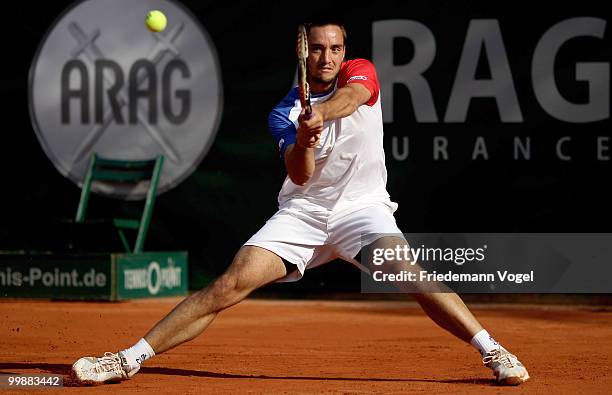 Viktor Troicki of Serbia plays a backhand during his match against Jeremy Chardy of France during day three of the ARAG World Team Cup at the...