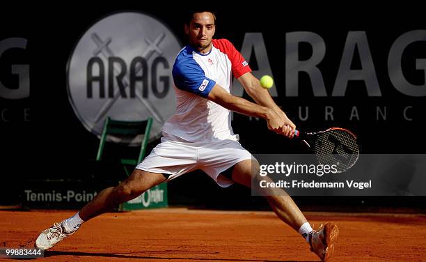 Viktor Troicki of Serbia plays a backhand during his match against Jeremy Chardy of France during day three of the ARAG World Team Cup at the...