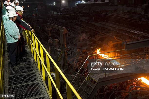 President Barack Obama tours through V & M Star, a leading producer of seamless pipe for the oil and gas industry, in Youngstown, Ohio, May 18, 2010....