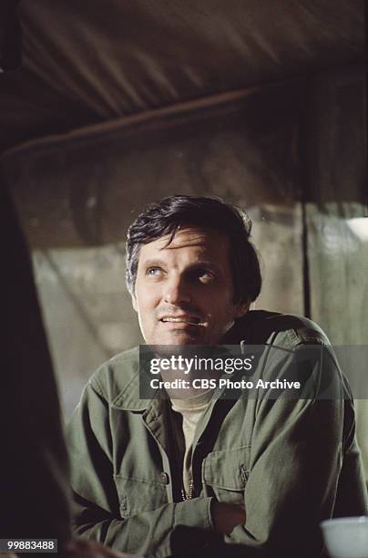 American actor Alan Alda in costume as Captain Benjamin Pierce in a scene from an episode of the television series 'MASH,' California, 1975.