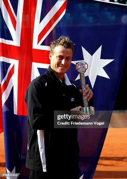 Lleyton Hewitt of Australia receives the fair play trophy during day three of the ARAG World Team Cup at the Rochusclub on May 18, 2010 in...