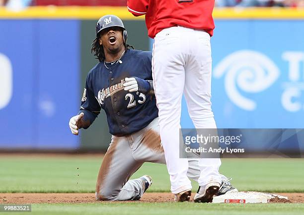 Rickie Weeks of the Milwaukee Brewers reacts after being tagged out while attempting to steal second base by Orlando Cabrera of the Cincinnati Reds...