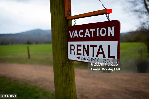 vacation rental sign for country home - country home stock-fotos und bilder
