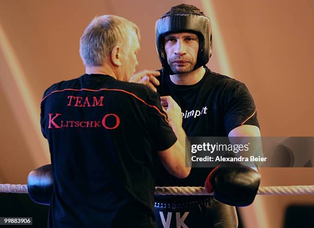 Ukrainian boxer Vitali Klitschko listens to his coach Fritz Sdunek during a training session on May 18, 2010 in Going, Austria. The WBC Heavyweight...
