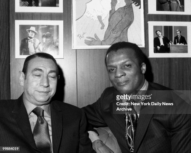 Announcer Howard Cosell and baseball player Curt Flood sit backstage at WABC-TV Studio 15 prior to their appearance on the Dick Cavett show on...