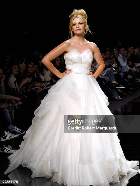 Mischa Barton presents a creation from Rosa Clara's latest bridal collection 2011, at the Fira 2 Barcelona on May 18, 2010 in Barcelona, Spain.