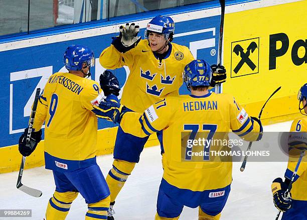 Sweden's Magnus Paajarvi Svensson celebrates scoring with Sweden's Tony Martensson and Sweden's Victor Hedman during the IIHF Ice Hockey World...