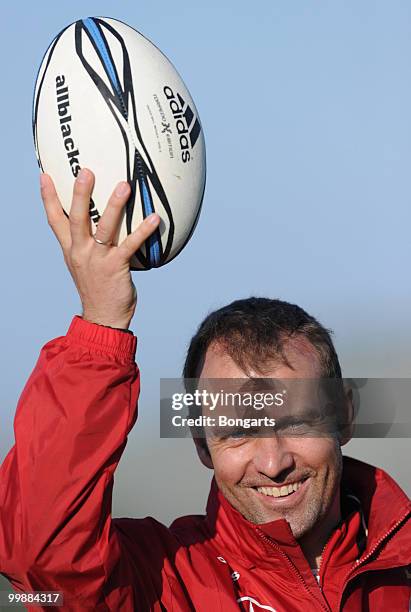 Assistant coach Hans Dieter Flick of Germany holds up a rugby ball during a German National Team Rugby training session at Verdura Golf & Spa Resort...