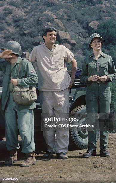 From left, American actors Gary Burghoff, as Corporal Walter Radar O'Reily, Alan Alda, as Captain Benjamin Hawkeye Pierce, and Loretta Swit, as Major...