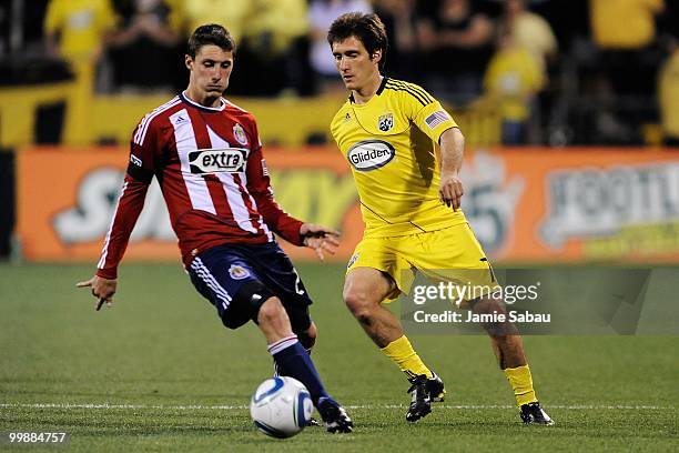 Guillermo Barros Schelotto of the Columbus Crew controls the ball as Ben Zemanski of Chivas USA defends on May 15, 2010 at Crew Stadium in Columbus,...