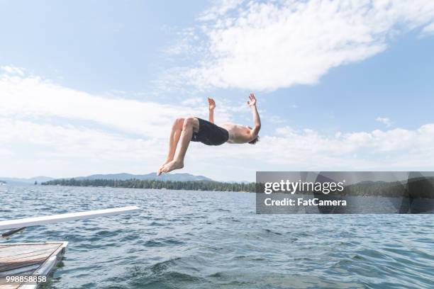 young man does a backflip into a lake - 2017 usa diving summer stock pictures, royalty-free photos & images