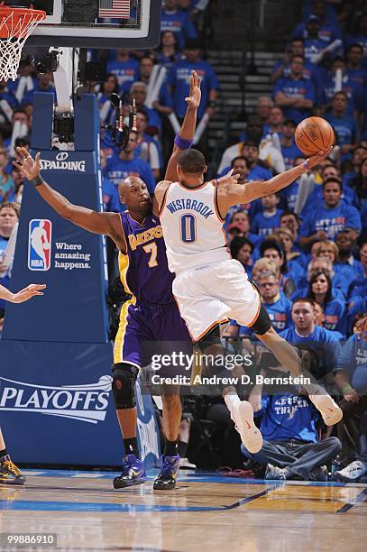Russell Westbrook of the Oklahoma City Thunder goes to the basket against Lamar Odom of the Los Angeles Lakers in Game Six of the Western Conference...